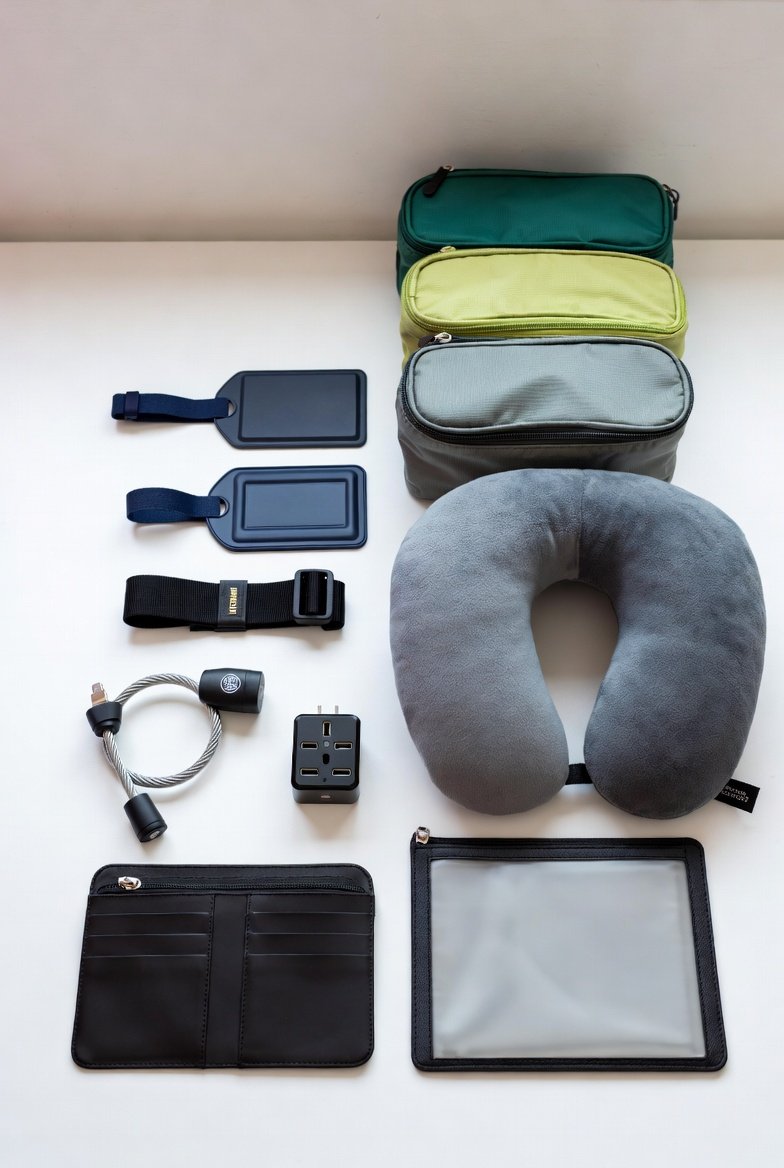 Travel accessories neatly laid out on a white surface