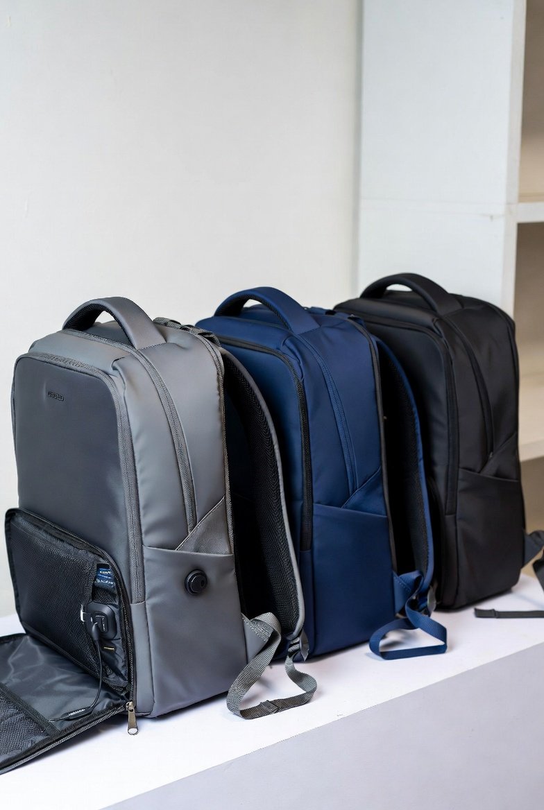 Travel and laptop backpacks displayed in a Singapore wholesale setting